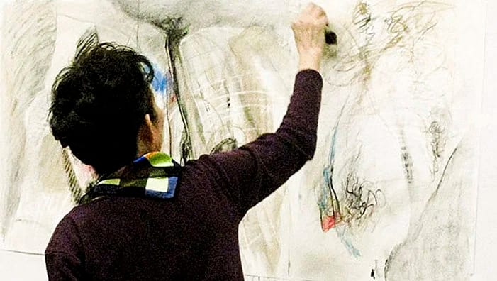 Nami Yang painting in her studio